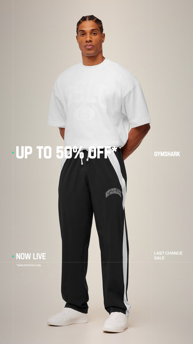 Figure 5. Gymshark static clothing ad showing a model in a white shirt and black trousers with up to 50 percent off, Last Chance, and selected-lines text